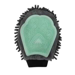 Pet grooming glove with green paw-shaped rubber brush on white