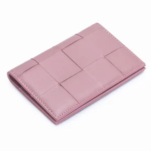 Woven passport holder shown closed with textured exterior detail