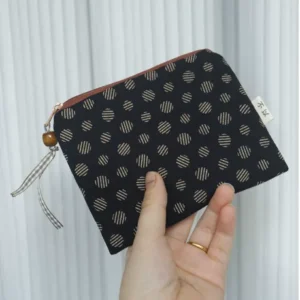 Linen cotton coin purse with zip closure shown flat on a plain background