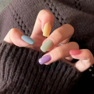 Medium-length press-on nail stickers set laid out with tools
