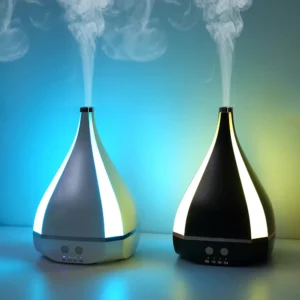 7 color aroma machine on a desk with essential oils